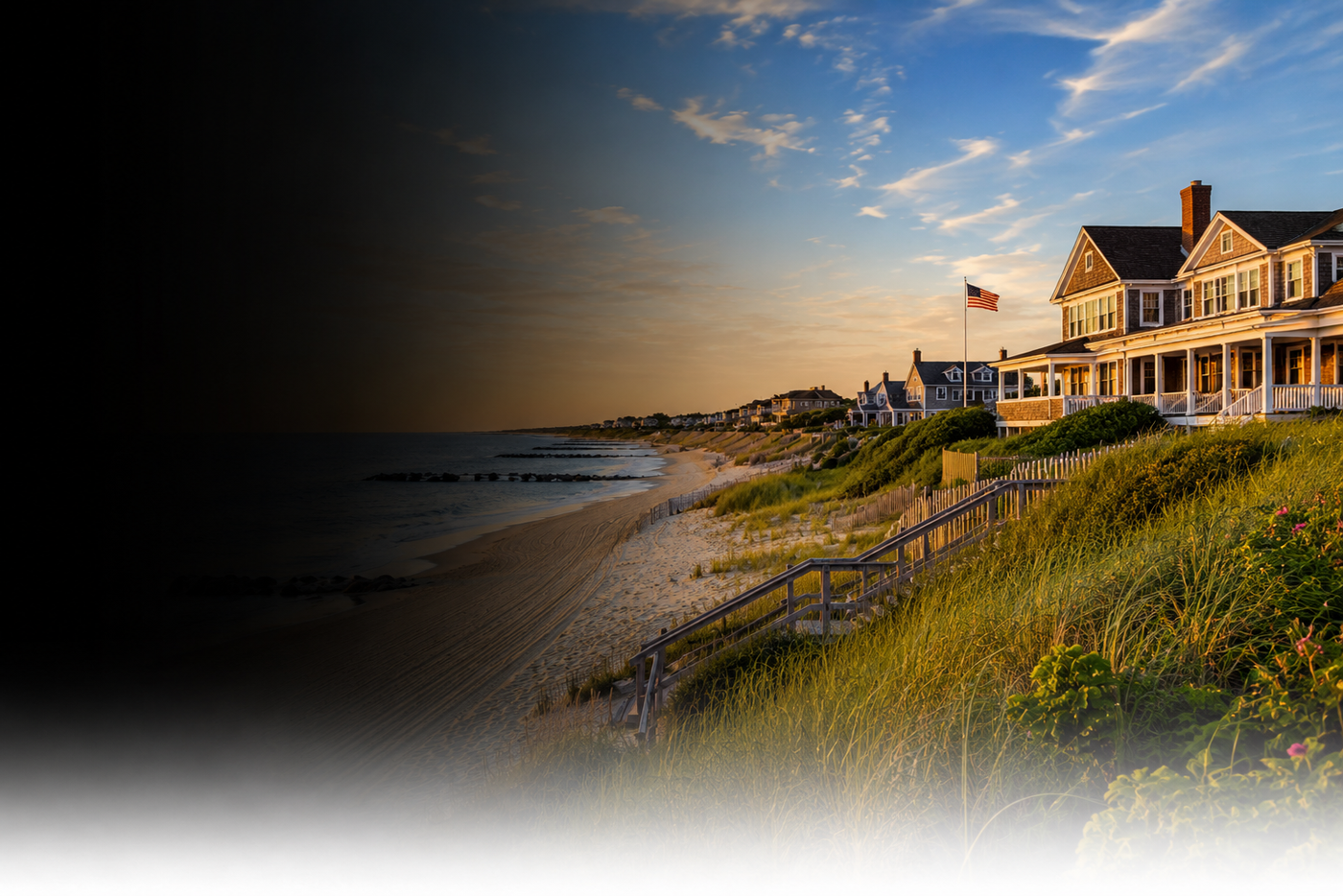Beachfront house with a flag at sunset