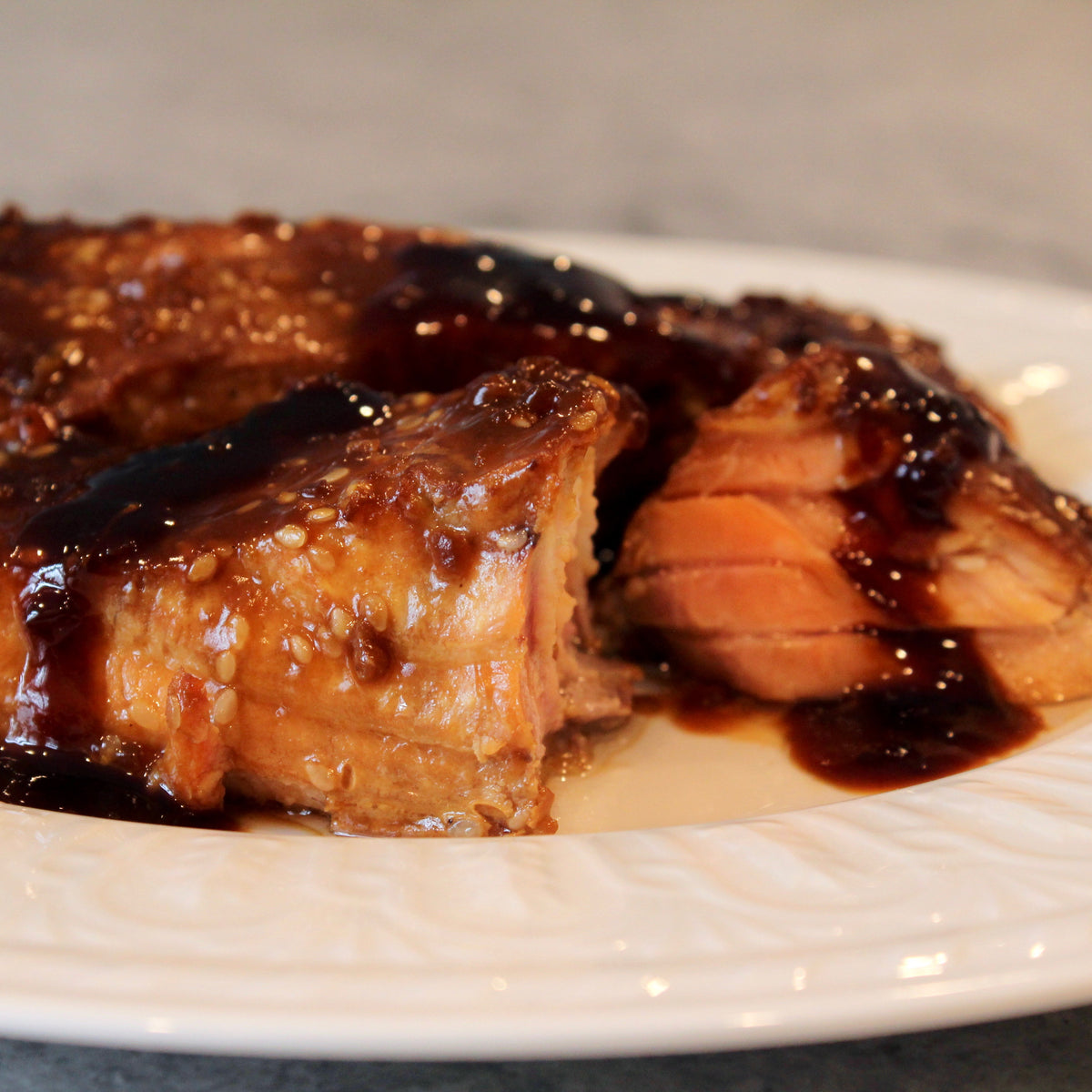 http://thekmp.com/cdn/shop/products/Teriyaki-GlazedPremiumFarmedSalmonwithToastedSesameSeeds3_1200x1200.jpg?v=1609689215