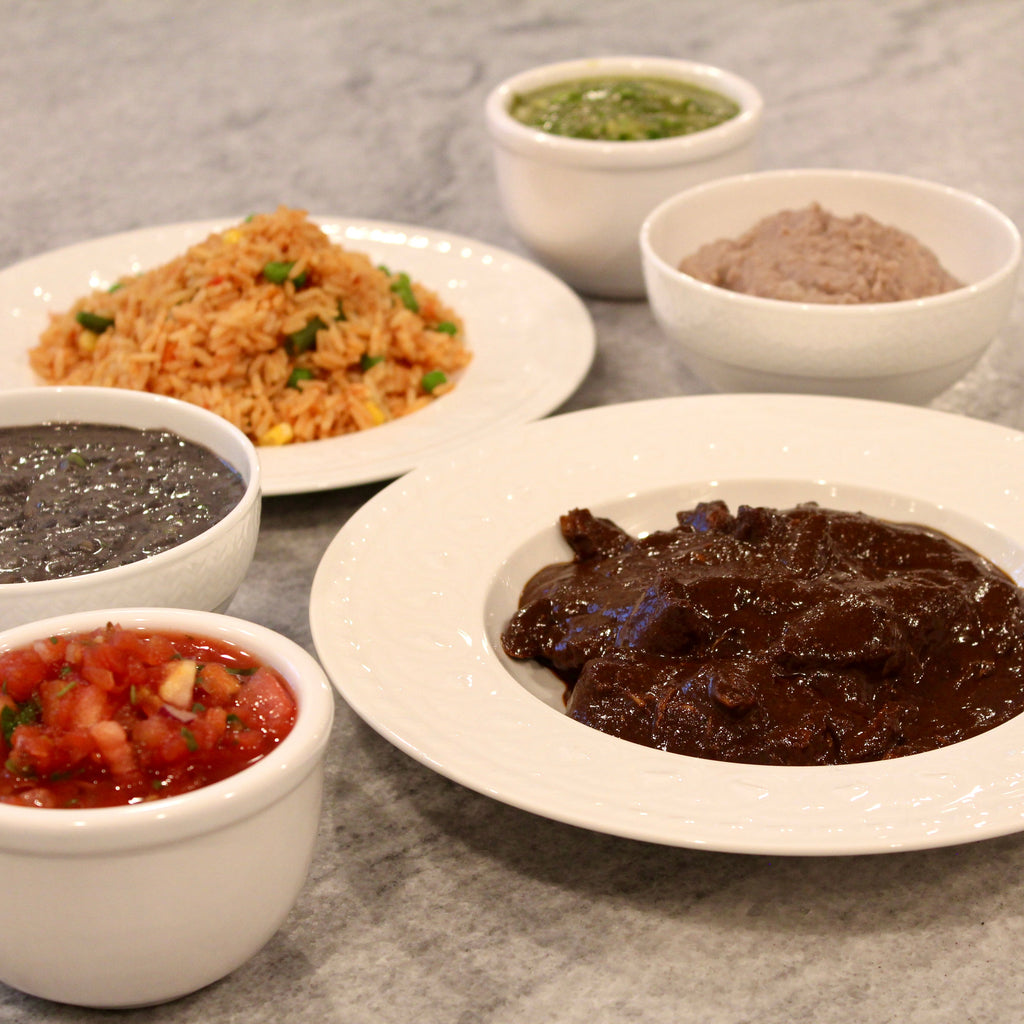 Pictured with Chicken Mole, Salsa Roja, Mexican Rice with Vegetables, Green Tomatillo Salsa & Refried Black Beans.