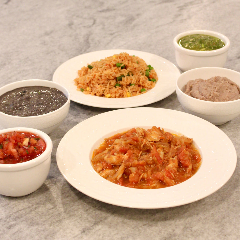 Pictured with Chicken Tinga, Salsa Roja, Mexican Rice with Vegetables, Green Tomatillo Salsa & Refried Pinto Beans.